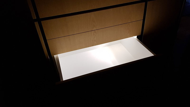 Drawer lighting with magnetic switched LED strip